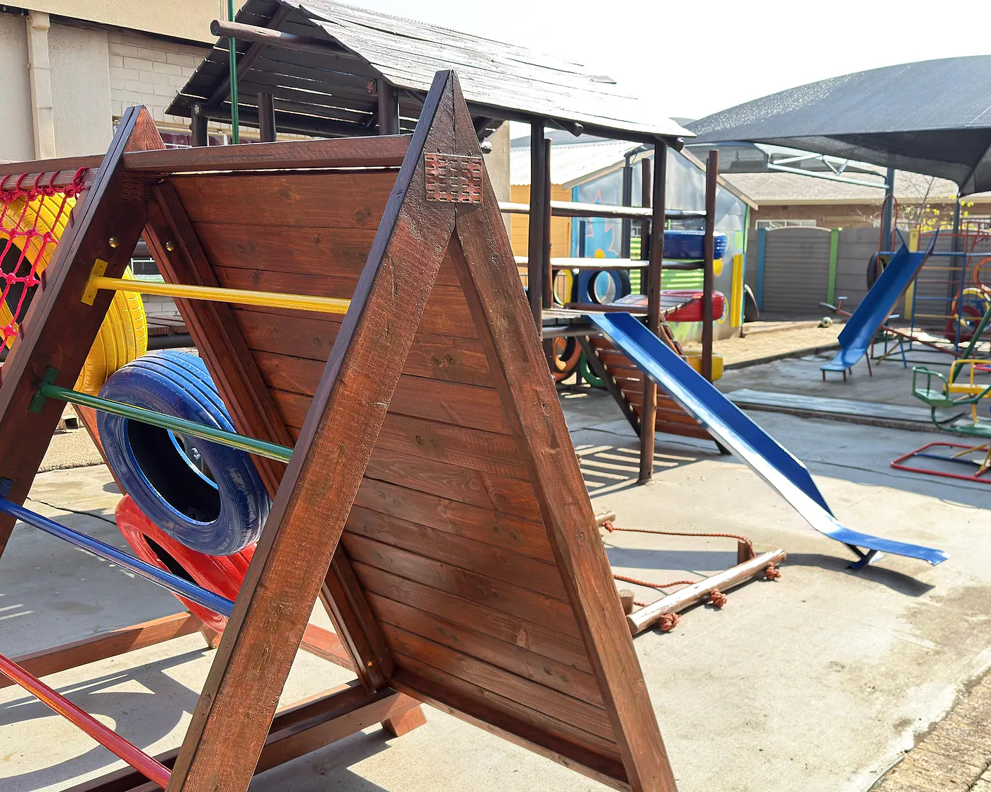 The real Lions Heart playground with wooden climbing equipment, slides and shaded play areas