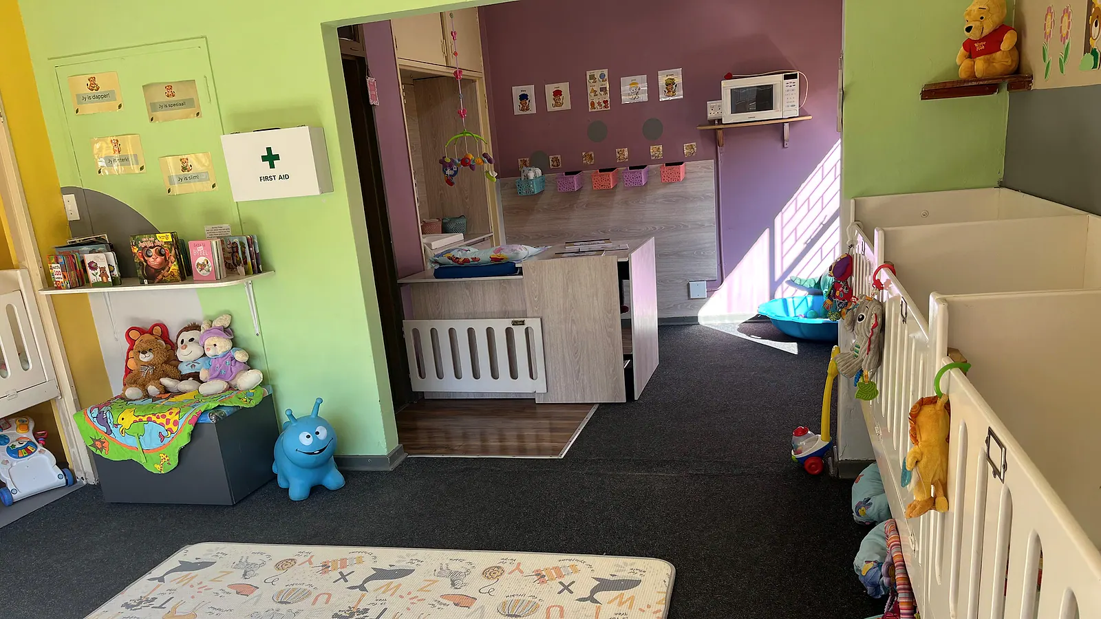 The real Lions Cub nursery room with cots, soft play space and morning light